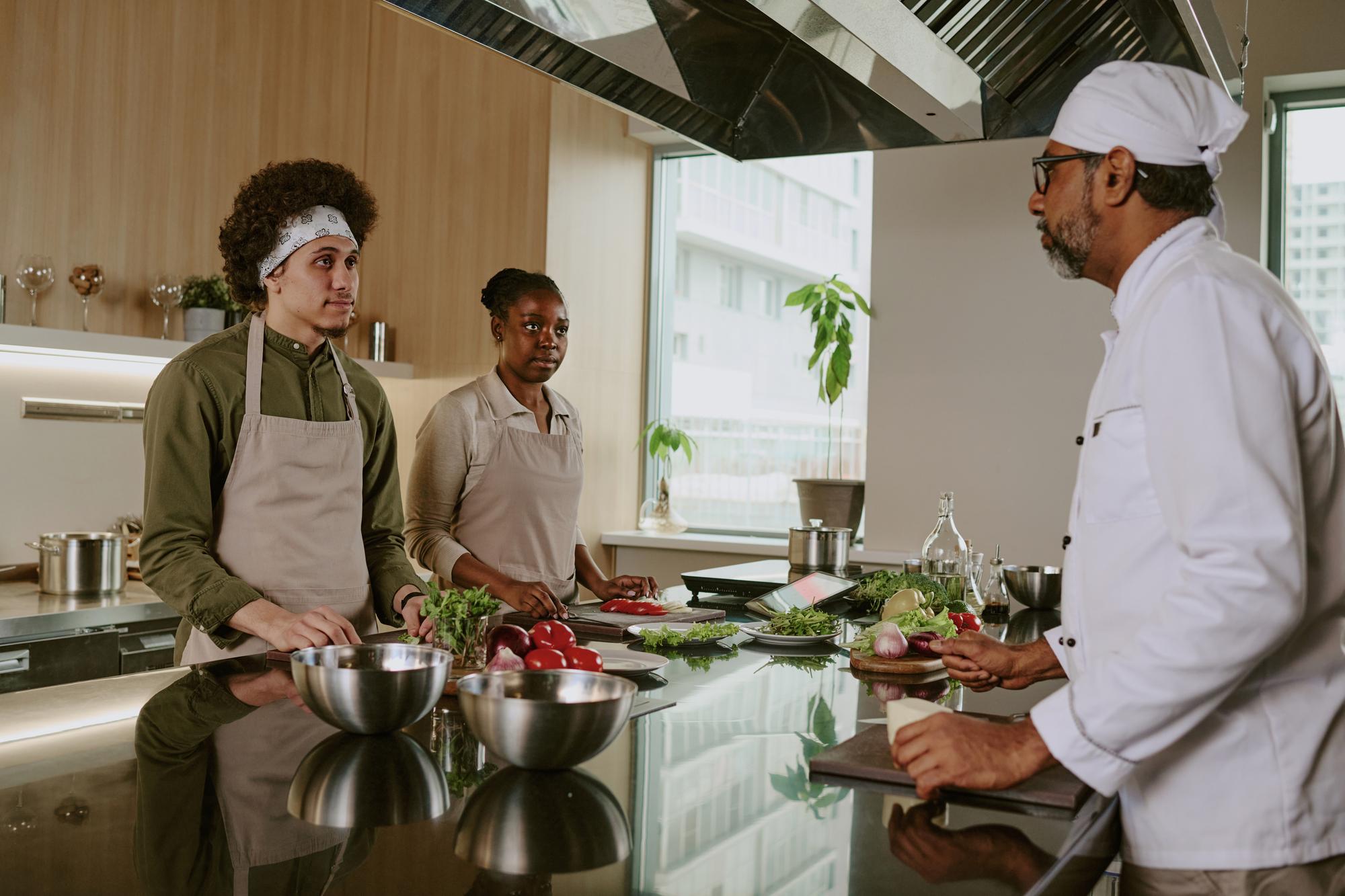 Open kitchen workspace with chefs collaborating