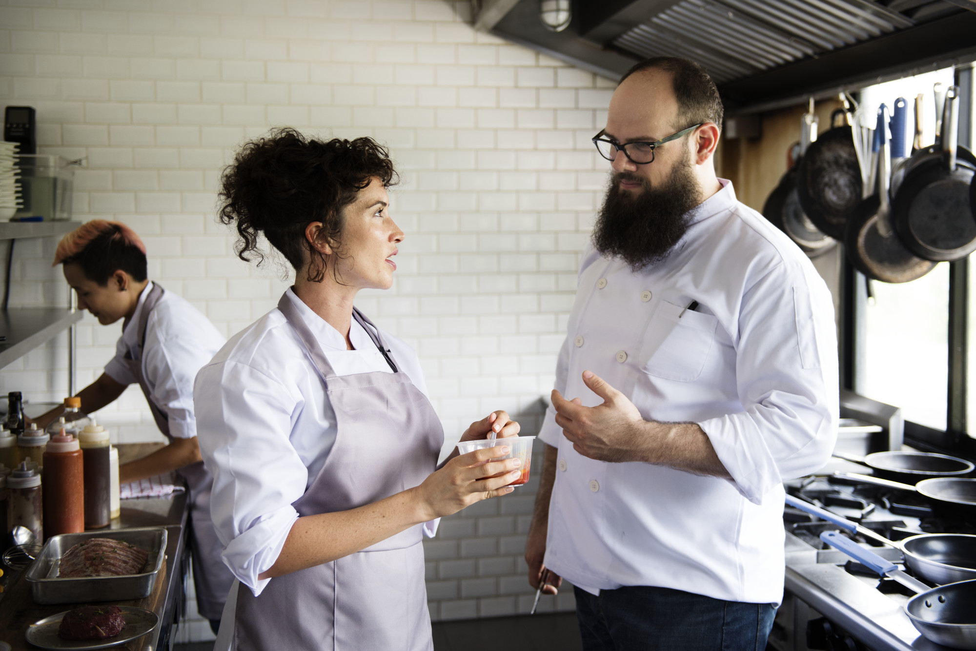 Workshop chef talking to a small team